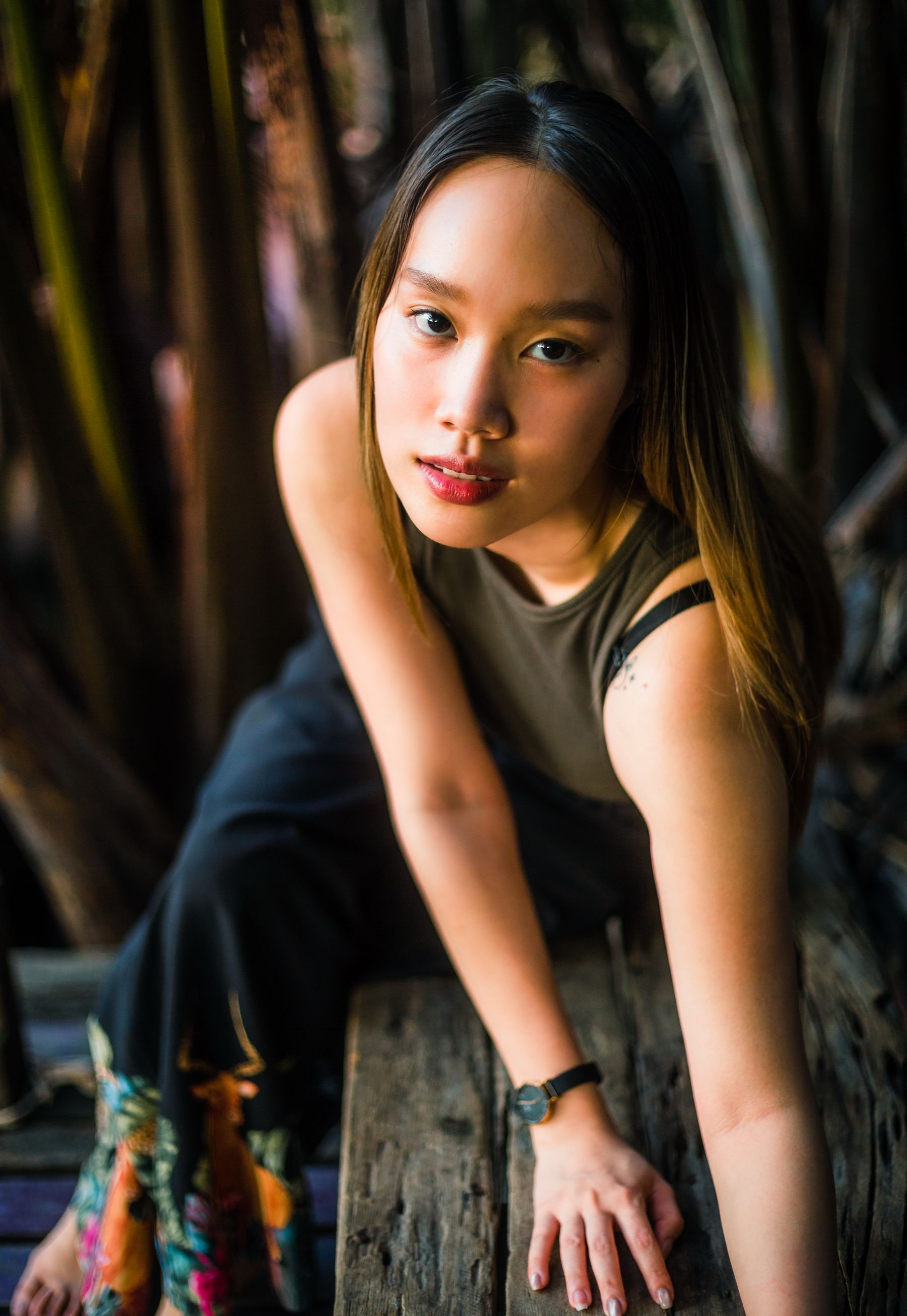 Placeholder: Seated woman in natural light